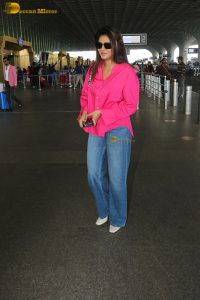 Indian actress and social media influencer anjali arora cute in a pink shirt and denim jeans