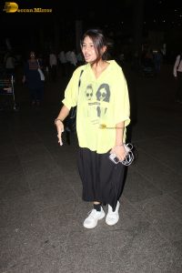 actress and social media influencer Anjali Arora cute in a yellow shirt at mumbai airport