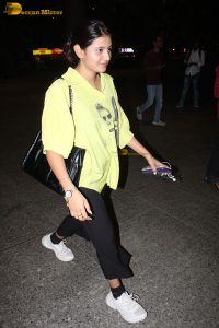 actress and social media influencer Anjali Arora cute in a yellow shirt at mumbai airport