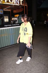actress and social media influencer Anjali Arora cute in a yellow shirt at mumbai airport