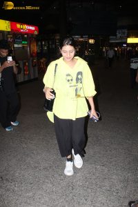 actress and social media influencer Anjali Arora cute in a yellow shirt at mumbai airport