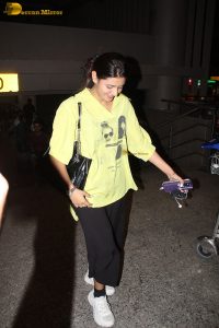 actress and social media influencer Anjali Arora cute in a yellow shirt at mumbai airport