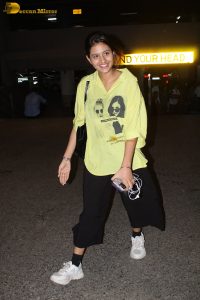 actress and social media influencer Anjali Arora cute in a yellow shirt at mumbai airport