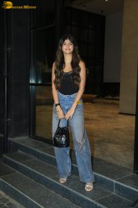 actress anjini dhawan in a black top and blue denim jeans