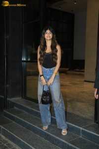 actress anjini dhawan in a black top and blue denim jeans