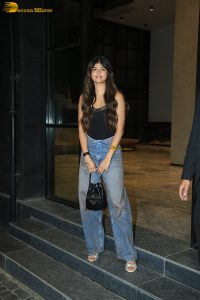 actress anjini dhawan in a black top and blue denim jeans