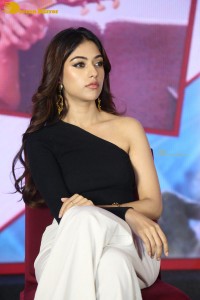 Actress Anu Emmanuel in a black top attending a movie function