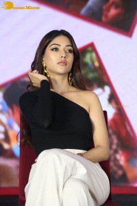 Actress Anu Emmanuel in a black top attending a movie function