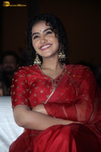 Actress Anupama Parameswaran in a red lehenga choli at a function