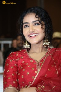 Actress Anupama Parameswaran in a red lehenga choli at a function