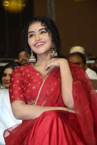 Actress Anupama Parameswaran in a red lehenga choli at a function