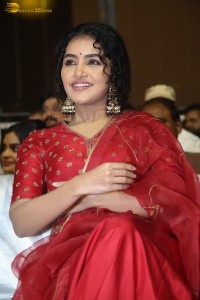 Actress Anupama Parameswaran in a red lehenga choli at a function