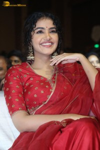 Actress Anupama Parameswaran in a red lehenga choli at a function