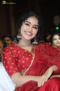 Actress Anupama Parameswaran in a red lehenga choli at a function