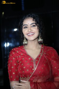 Actress Anupama Parameswaran in a red lehenga choli at a function