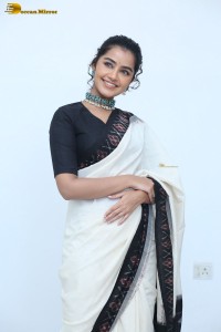 Anupama Parameswaran in a black and white saree