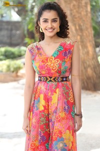 Actress Anupama Parameswaran in a orange floral dress