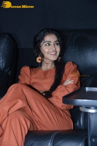 Actress Anupama Parameswaran in a reddish brown dress while attending a movie function