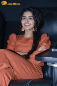 Actress Anupama Parameswaran in a reddish brown dress while attending a movie function
