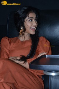 Actress Anupama Parameswaran in a reddish brown dress while attending a movie function