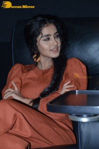 Actress Anupama Parameswaran in a reddish brown dress while attending a movie function