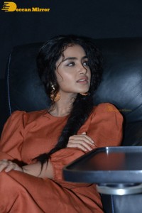 Actress Anupama Parameswaran in a reddish brown dress while attending a movie function