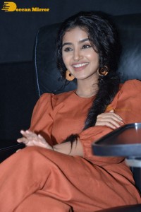 Actress Anupama Parameswaran in a reddish brown dress while attending a movie function