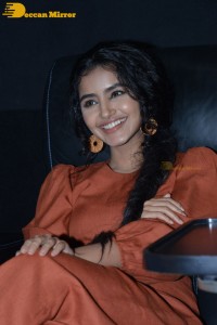 Actress Anupama Parameswaran in a reddish brown dress while attending a movie function