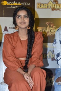 Actress Anupama Parameswaran in a reddish brown dress while attending a movie function