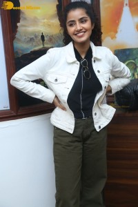 Actress Anupama Parameswaran in khaki pants and white jacket