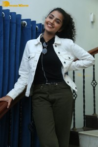 Actress Anupama Parameswaran in khaki pants and white jacket