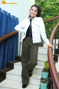 Actress Anupama Parameswaran in khaki pants and white jacket