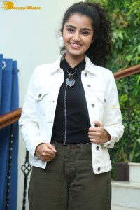 Actress Anupama Parameswaran in khaki pants and white jacket