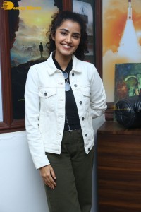 Actress Anupama Parameswaran in khaki pants and white jacket