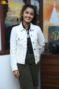 Actress Anupama Parameswaran in khaki pants and white jacket