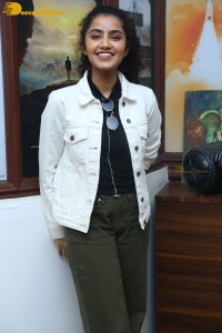 Actress Anupama Parameswaran in khaki pants and white jacket
