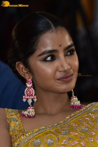 Actress Anupama Parameswaran in a yellow saree