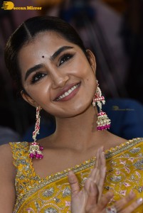 Actress Anupama Parameswaran in a yellow saree