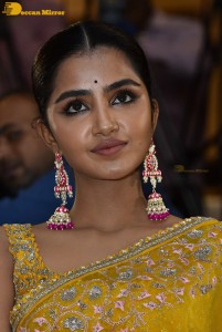 Actress Anupama Parameswaran in a yellow saree