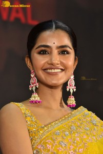 Actress Anupama Parameswaran in a yellow saree