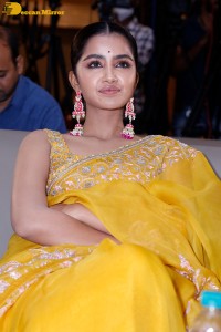 Actress Anupama Parameswaran in a yellow saree