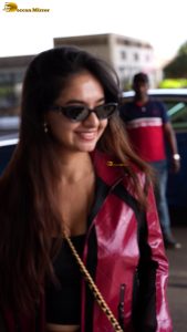 Indian tv and bollywood actress Anushka Sen cute in a maroon jacket at airport