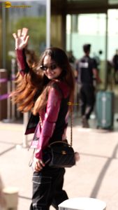 Indian tv and bollywood actress Anushka Sen cute in a maroon jacket at airport