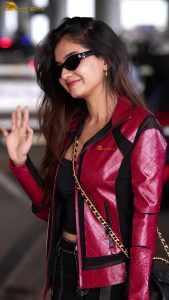 Indian tv and bollywood actress Anushka Sen cute in a maroon jacket at airport
