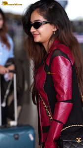 Indian tv and bollywood actress Anushka Sen cute in a maroon jacket at airport