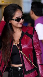 Indian tv and bollywood actress Anushka Sen cute in a maroon jacket at airport