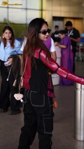 Indian tv and bollywood actress Anushka Sen cute in a maroon jacket at airport