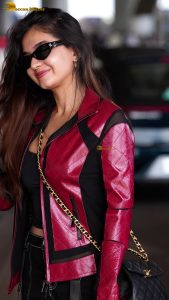 Indian tv and bollywood actress Anushka Sen cute in a maroon jacket at airport