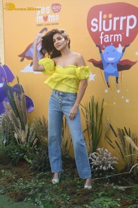 indian actress anushka sharma in a yellow top and blue jeans