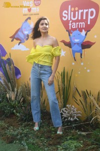 indian actress anushka sharma in a yellow top and blue jeans